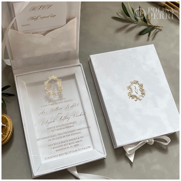 invitations in white velvet boxes